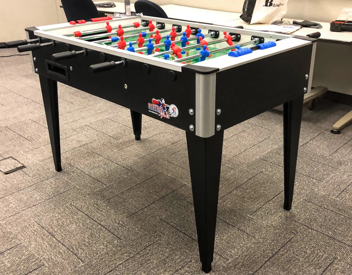 Roberto Foosball table in a gaming room Logo View in an office